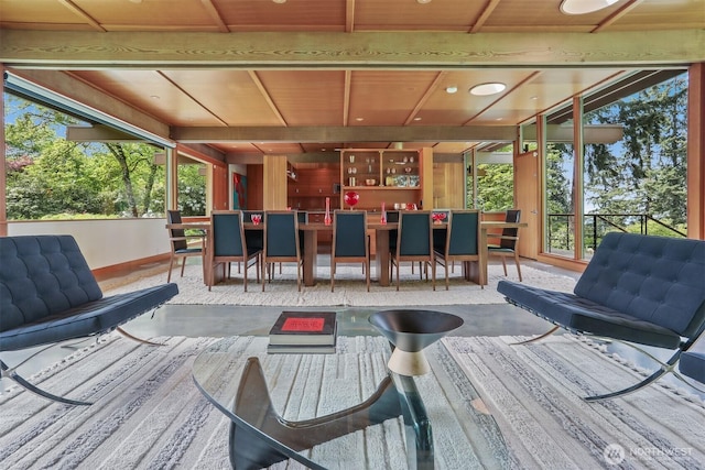 deck featuring outdoor dining area and a patio area