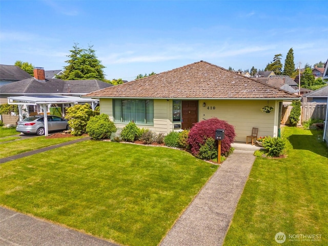 410 W 4th St, Aberdeen, WA 98520 - view of front of house featuring a front yard and a carport