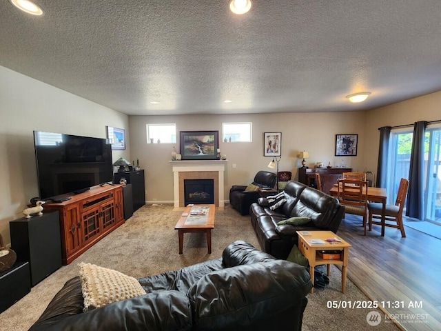 13816 NE 63rd St, Vancouver, WA 98682 - carpeted living area with a textured ceiling, a tile fireplace, and recessed lighting