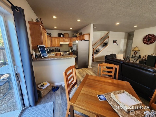 13816 NE 63rd St, Vancouver, WA 98682 - dining room with light wood finished floors, stairs, recessed lighting, and a textured ceiling