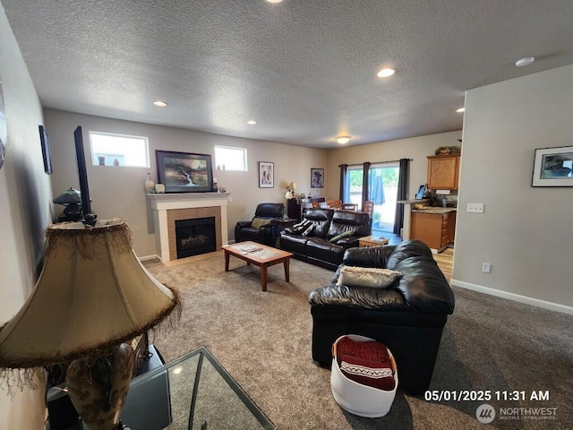 13816 NE 63rd St, Vancouver, WA 98682 - carpeted living area featuring a textured ceiling, a tile fireplace, recessed lighting, and baseboards