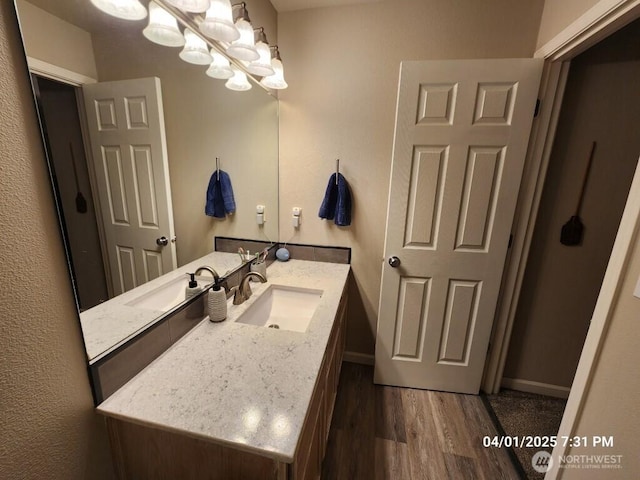 13816 NE 63rd St, Vancouver, WA 98682 - bathroom with wood finished floors, a chandelier, vanity, and baseboards