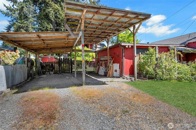 1420 S Verde St, Tacoma, WA 98405 - view of car parking with a storage shed, a carport, and driveway