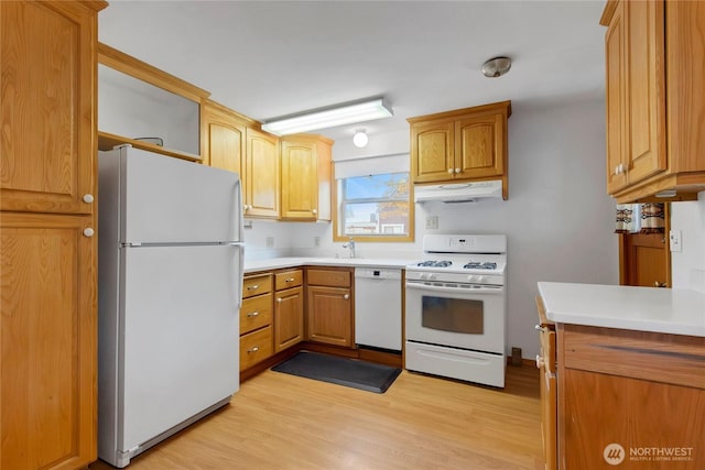 1420 S Verde St, Tacoma, WA 98405 - kitchen featuring white appliances, under cabinet range hood, light wood-type flooring, and light countertops