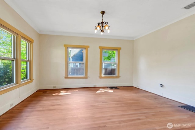 1420 S Verde St, Tacoma, WA 98405 - spare room featuring a chandelier, light wood-style flooring, baseboards, and ornamental molding