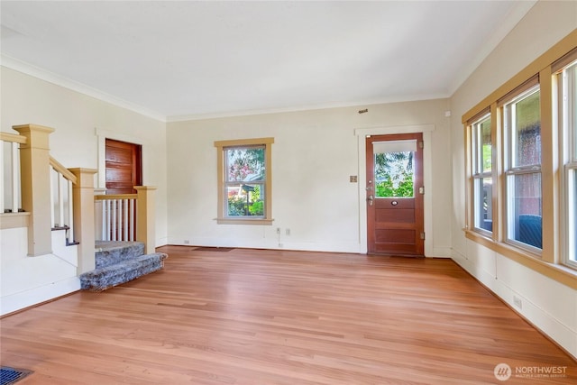 1420 S Verde St, Tacoma, WA 98405 - unfurnished living room with light wood-style flooring, stairway, and crown molding