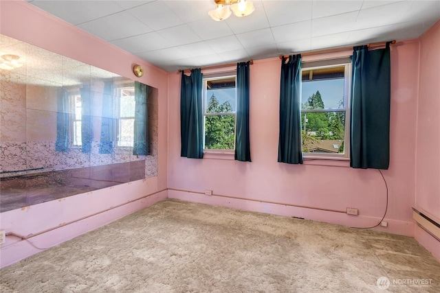 1420 S Verde St, Tacoma, WA 98405 - carpeted empty room with a baseboard radiator