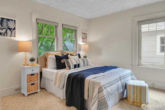 bedroom featuring crown molding