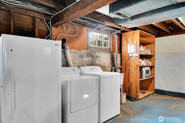clothes washing area featuring washing machine and dryer
