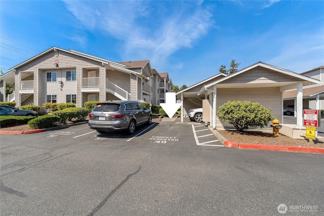 view of property with uncovered parking