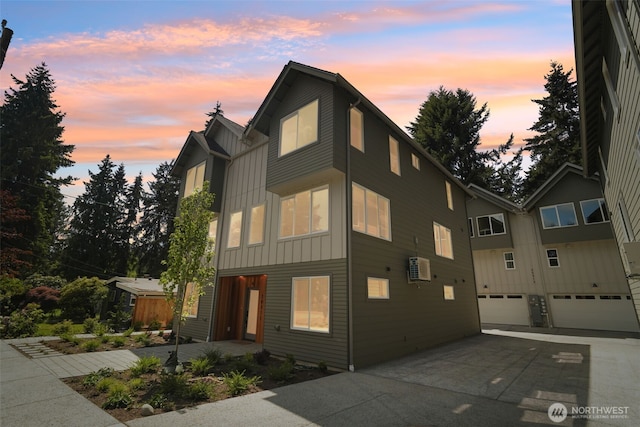 20311 14th Ave NE Unit A, Shoreline, WA 98155 - view of front of house with board and batten siding, concrete driveway, and an attached garage