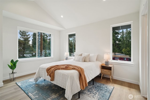 20311 14th Ave NE Unit A, Shoreline, WA 98155 - bedroom with recessed lighting, lofted ceiling, baseboards, and light wood-style flooring
