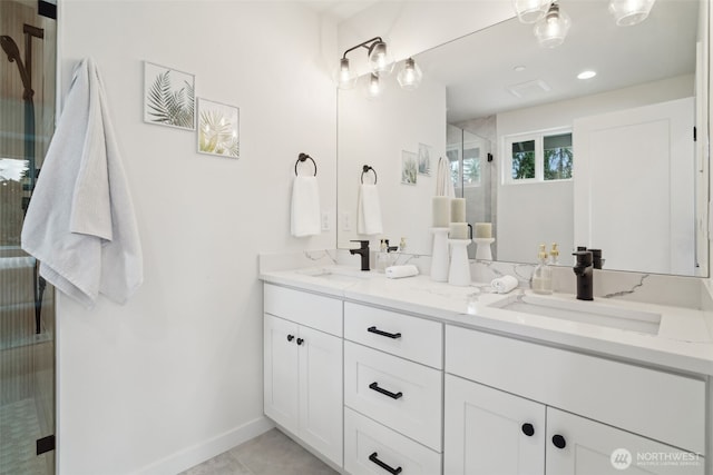 20311 14th Ave NE Unit A, Shoreline, WA 98155 - bathroom with double vanity, a shower stall, baseboards, and tile patterned flooring