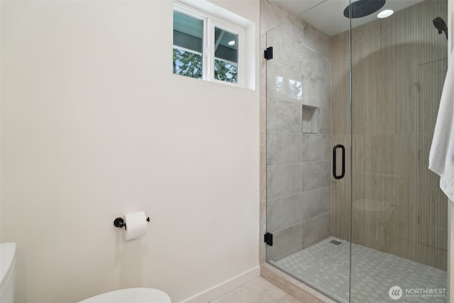 20311 14th Ave NE Unit A, Shoreline, WA 98155 - full bath featuring a stall shower, toilet, baseboards, and tile patterned floors