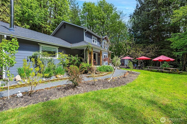 35717 321st St NE, Arlington, WA 98223 - view of front of home featuring a front lawn and a shingled roof