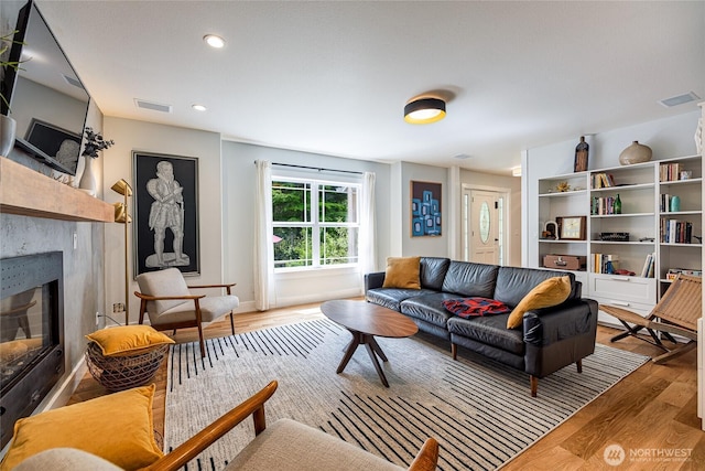 35717 321st St NE, Arlington, WA 98223 - living area with a high end fireplace, wood finished floors, baseboards, and recessed lighting
