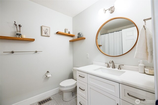 35717 321st St NE, Arlington, WA 98223 - full bath with tile patterned floors, vanity, toilet, baseboards, and a shower with shower curtain