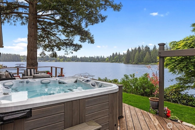 15208 W Lake Goodwin Rd, Stanwood, WA 98292 - wooden deck featuring a hot tub, a water view, and a view of trees