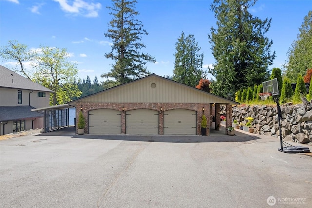 15208 W Lake Goodwin Rd, Stanwood, WA 98292 - view of front of house with brick siding, driveway, and an attached garage