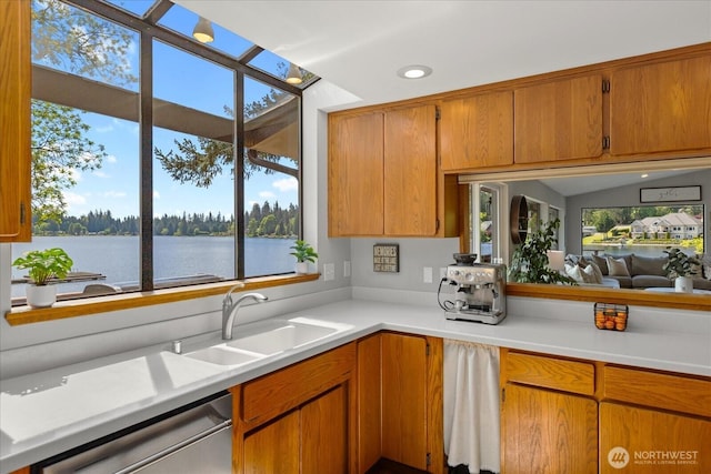 15208 W Lake Goodwin Rd, Stanwood, WA 98292 - kitchen featuring dishwasher, light countertops, a water view, a sink, and recessed lighting