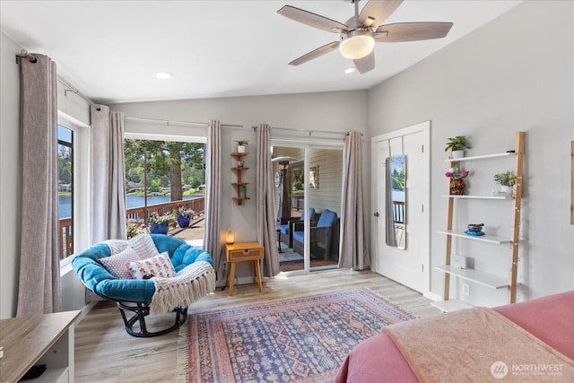15208 W Lake Goodwin Rd, Stanwood, WA 98292 - bedroom with lofted ceiling, access to outside, light wood-type flooring, recessed lighting, and ceiling fan