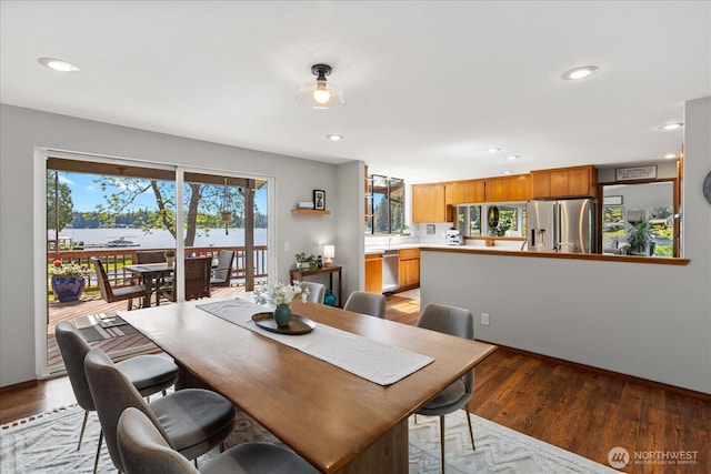 15208 W Lake Goodwin Rd, Stanwood, WA 98292 - dining space with light wood-type flooring, recessed lighting, and baseboards