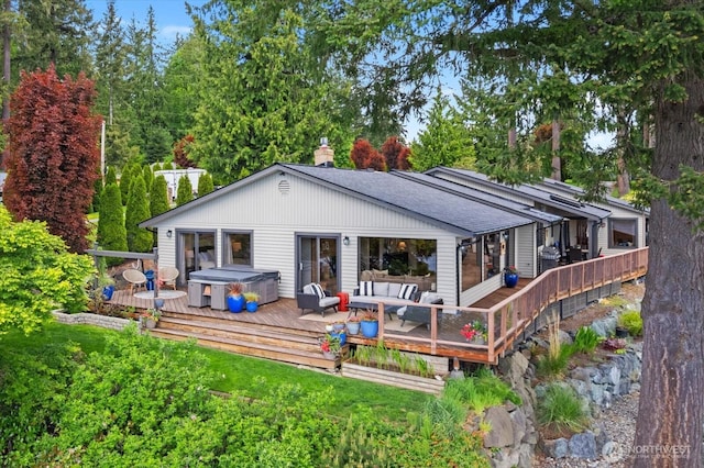 15208 W Lake Goodwin Rd, Stanwood, WA 98292 - rear view of house featuring outdoor lounge area, a deck, a chimney, and roof with shingles