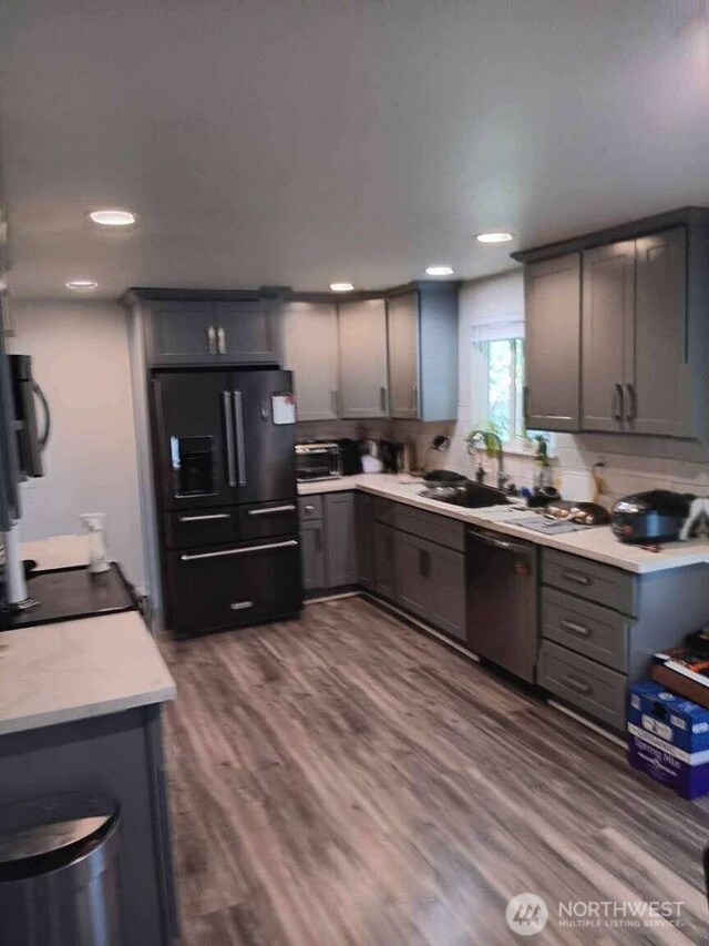 11705 Silver Way, Everett, WA 98208 - kitchen with dishwasher, black fridge, gray cabinetry, light countertops, and a sink