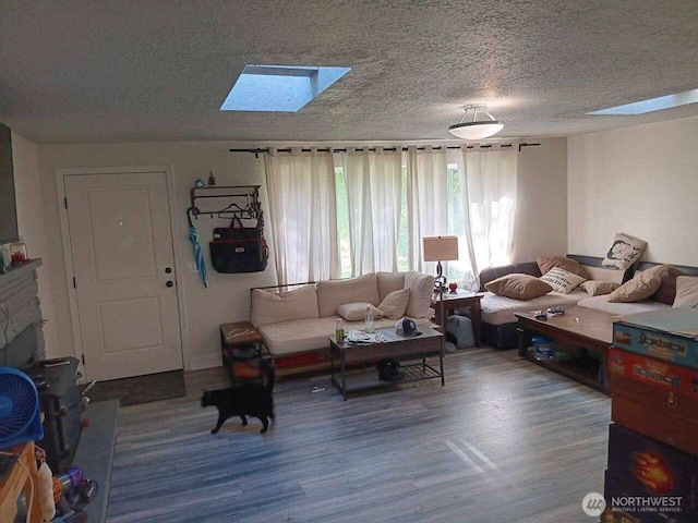 11705 Silver Way, Everett, WA 98208 - living area with a skylight, wood finished floors, and a textured ceiling