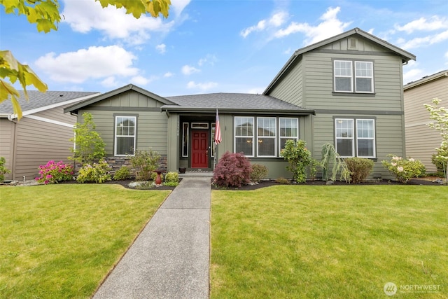 13708 Big Sky Dr E, Bonney Lake, WA 98391 - view of front of home featuring board and batten siding, a front yard, and roof with shingles