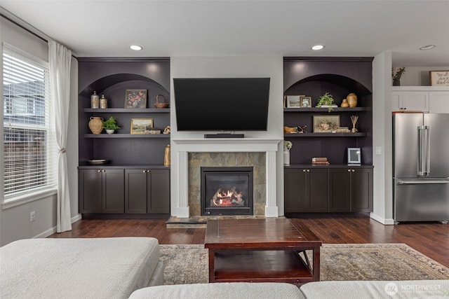 13708 Big Sky Dr E, Bonney Lake, WA 98391 - living room with dark wood-style floors and a tiled fireplace