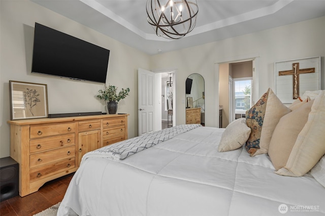 13708 Big Sky Dr E, Bonney Lake, WA 98391 - bedroom featuring a chandelier, dark wood-type flooring, and a tray ceiling