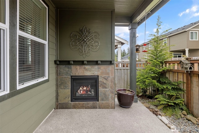13708 Big Sky Dr E, Bonney Lake, WA 98391 - view of patio featuring a fireplace and fence