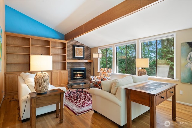 3912 Sutherland St, Gig Harbor, WA 98332 - living room with vaulted ceiling, wood finished floors, and a fireplace