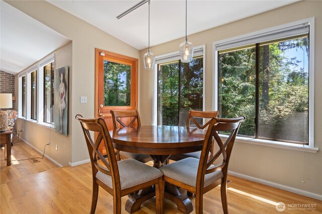3912 Sutherland St, Gig Harbor, WA 98332 - dining space with lofted ceiling, light wood-style flooring, and baseboards