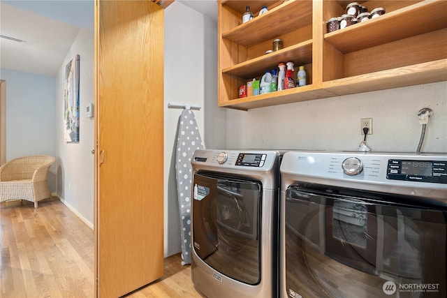 3912 Sutherland St, Gig Harbor, WA 98332 - laundry area featuring light wood finished floors and washing machine and clothes dryer