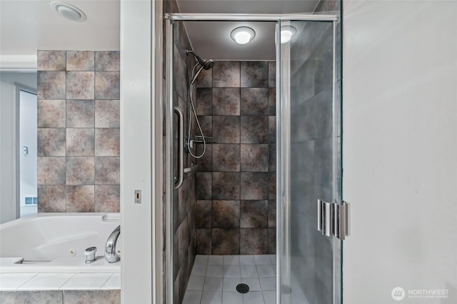 full bath with a jetted tub and a stall shower
