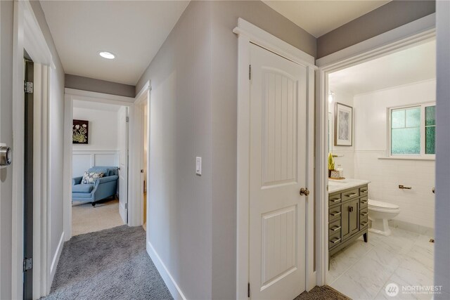 hall with a wainscoted wall