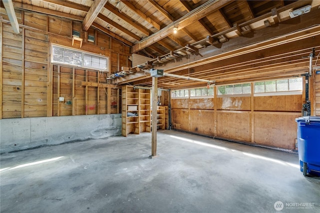 garage featuring wooden walls