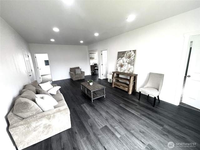 living room featuring recessed lighting and dark wood-style flooring