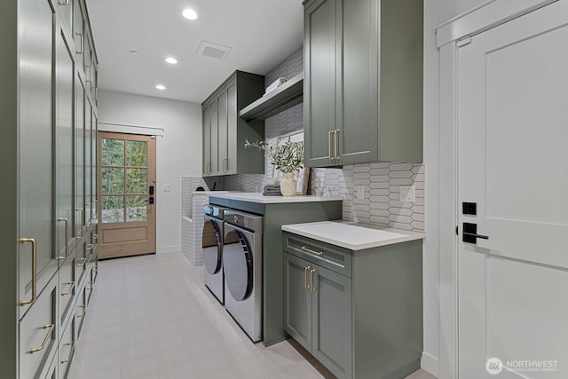 6993 N Fork Rd SE, Snoqualmie, WA 98065 - laundry room with cabinet space, washing machine and dryer, light floors, recessed lighting, and baseboards