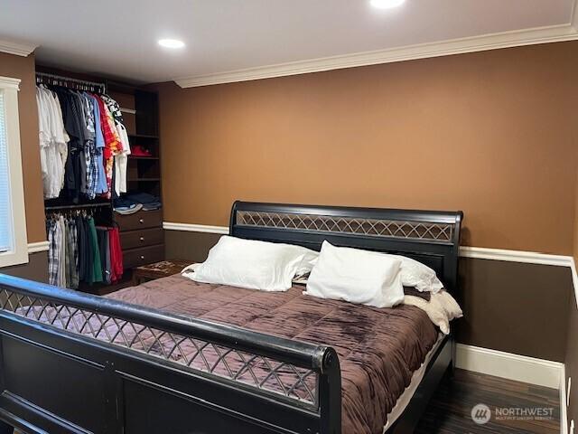 11717 93rd Ave NE Unit A7, Kirkland, WA 98034 - bedroom featuring baseboards, ornamental molding, wood finished floors, and recessed lighting