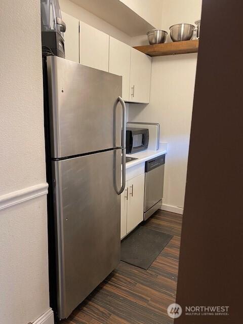 11717 93rd Ave NE Unit A7, Kirkland, WA 98034 - kitchen with appliances with stainless steel finishes, dark wood-type flooring, white cabinets, and light countertops