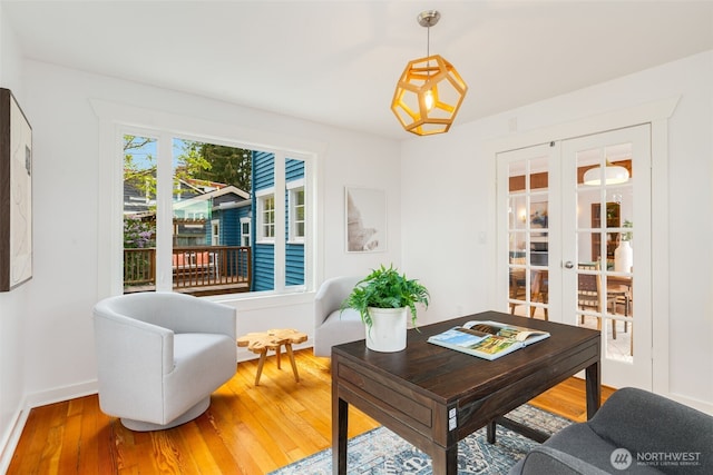 office area with french doors, hardwood / wood-style floors, and baseboards