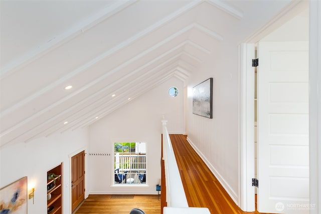 hallway with wood finished floors and recessed lighting