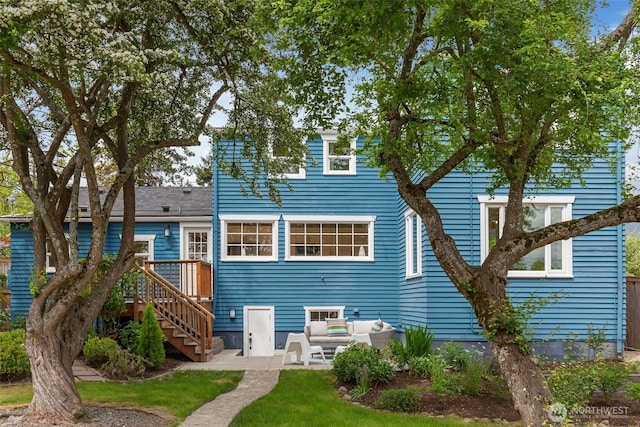 rear view of house with a patio and an outdoor hangout area