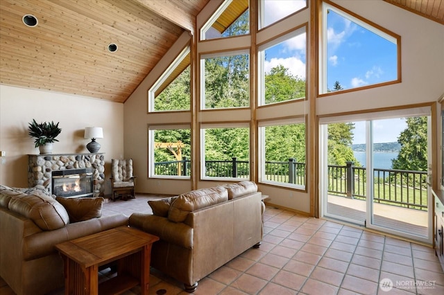 7353 Cedar House Ct, Clinton, WA 98236 - living room with high vaulted ceiling, a water view, light tile patterned floors, plenty of natural light, and wood ceiling