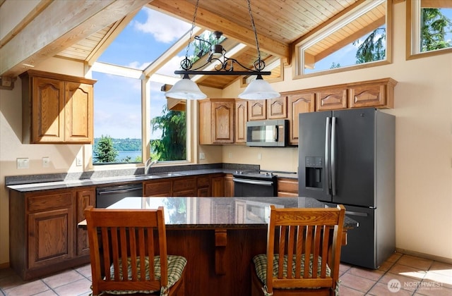 7353 Cedar House Ct, Clinton, WA 98236 - kitchen featuring fridge with ice dispenser, stainless steel microwave, a sink, electric range oven, and healthy amount of natural light