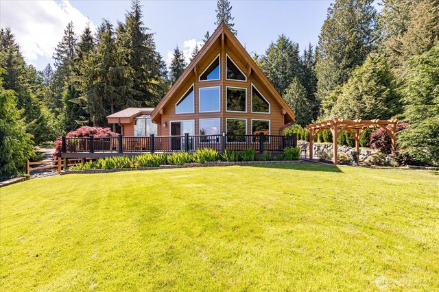 7353 Cedar House Ct, Clinton, WA 98236 - back of property with a deck, a pergola, and a lawn