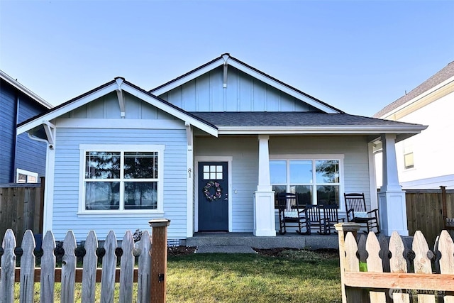 81 E Sullivan St, Allyn, WA 98524 - view of front of house with covered porch, board and batten siding, and a shingled roof